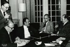 Louis Grunin and Mr. Siegel and others talk stamps at the Collectors Club of New York